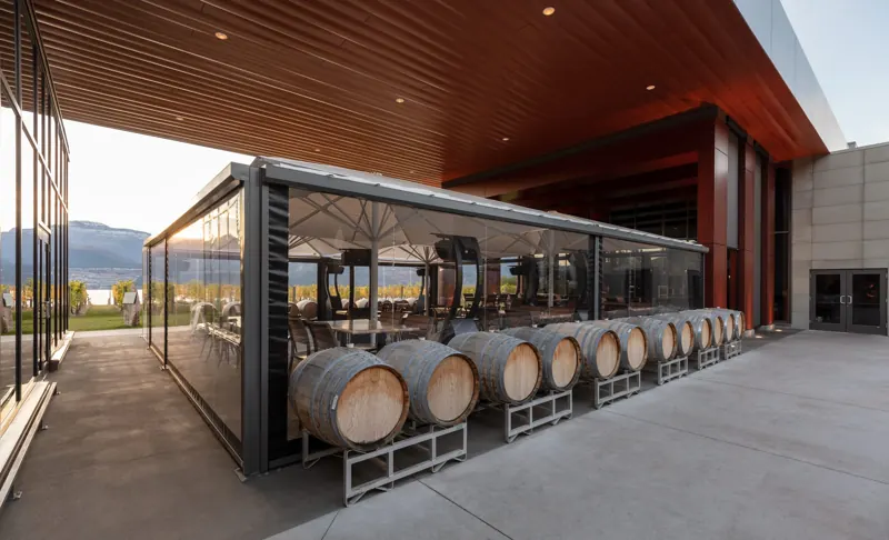 Barrels on the covered terrace with lake views
