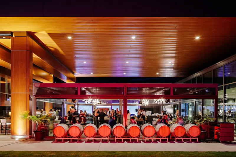 Barrel tables on the patio during an evening event